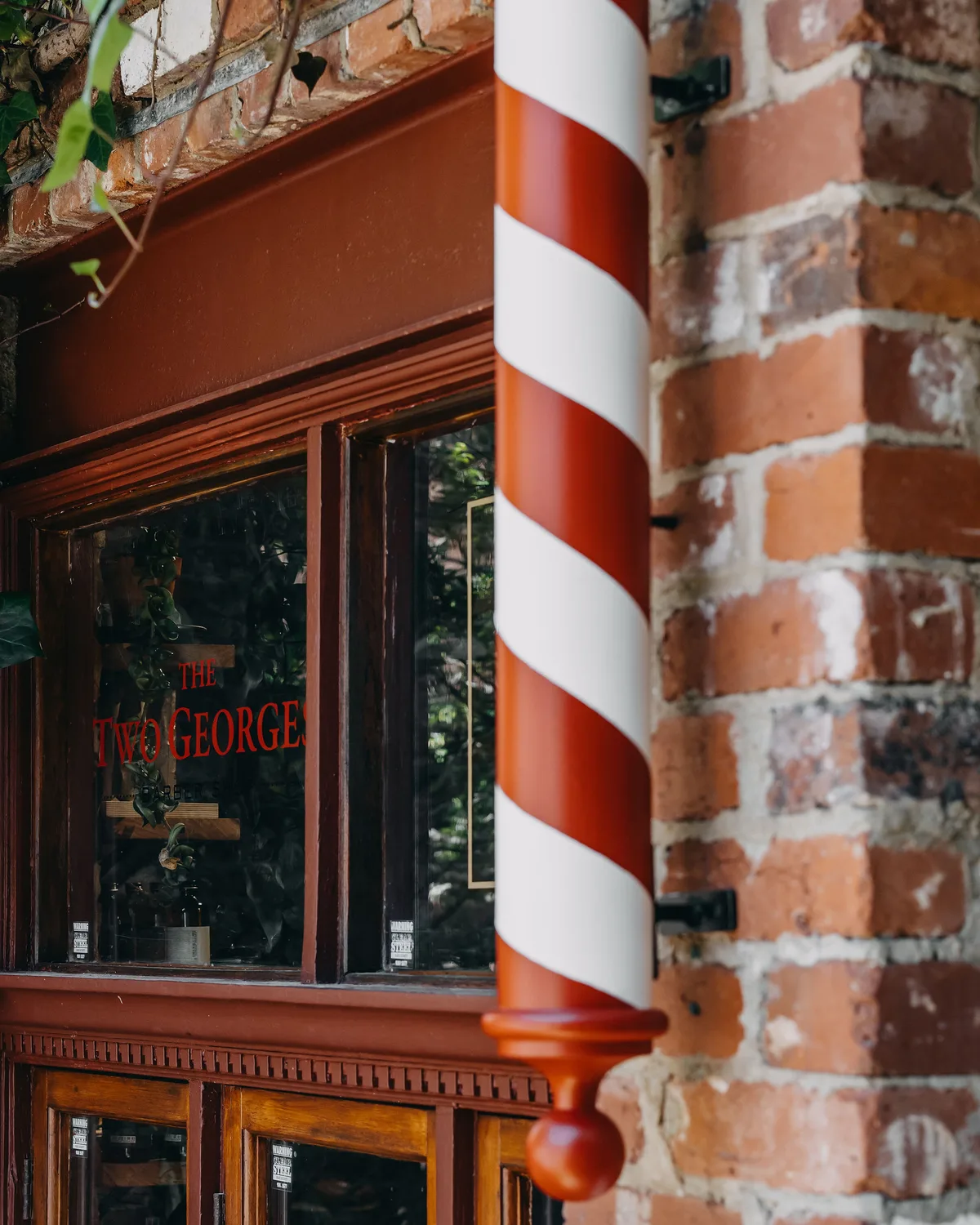 The brick archway and barber pole at 16A Bannister Street, Fremantle