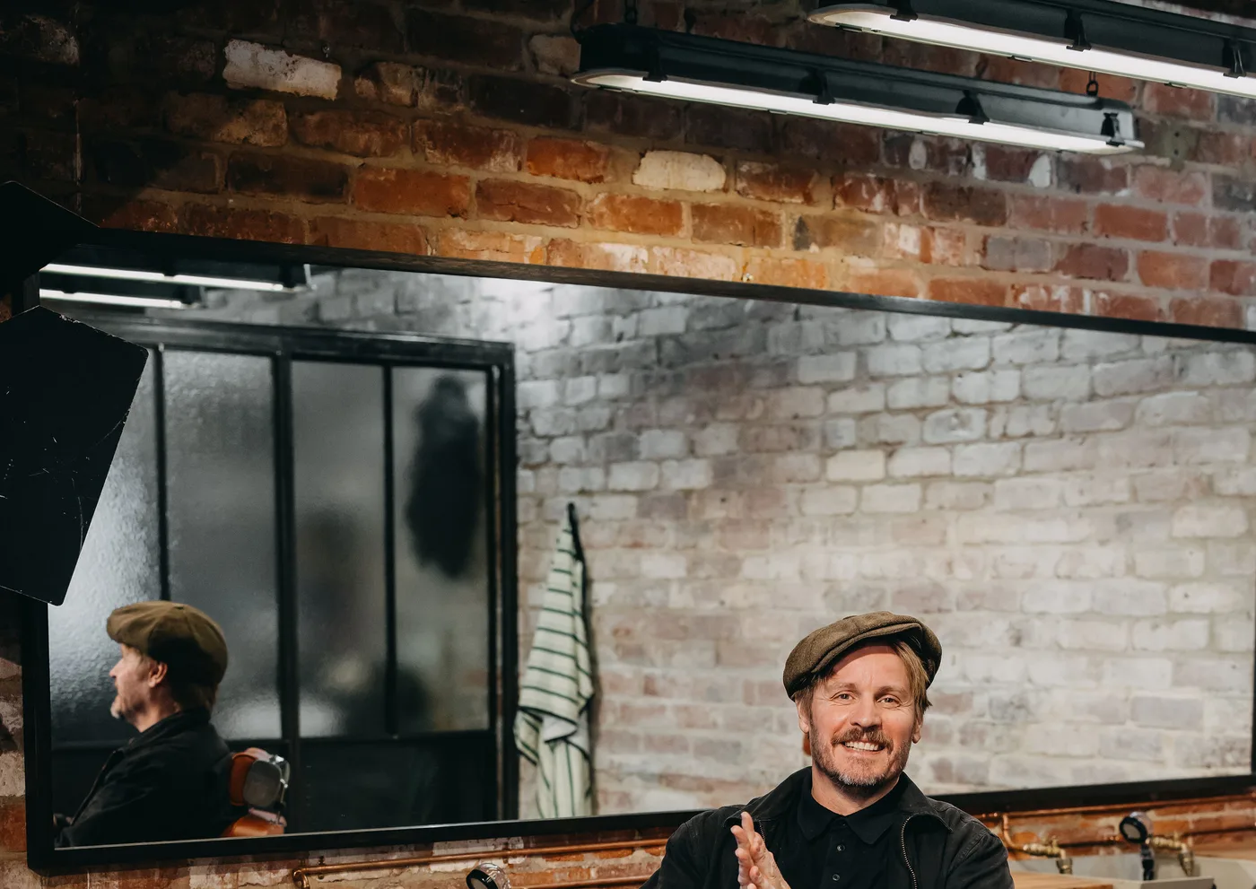 The mirror wall and the working chairs at The Two Georges barbershop, Fremantle
