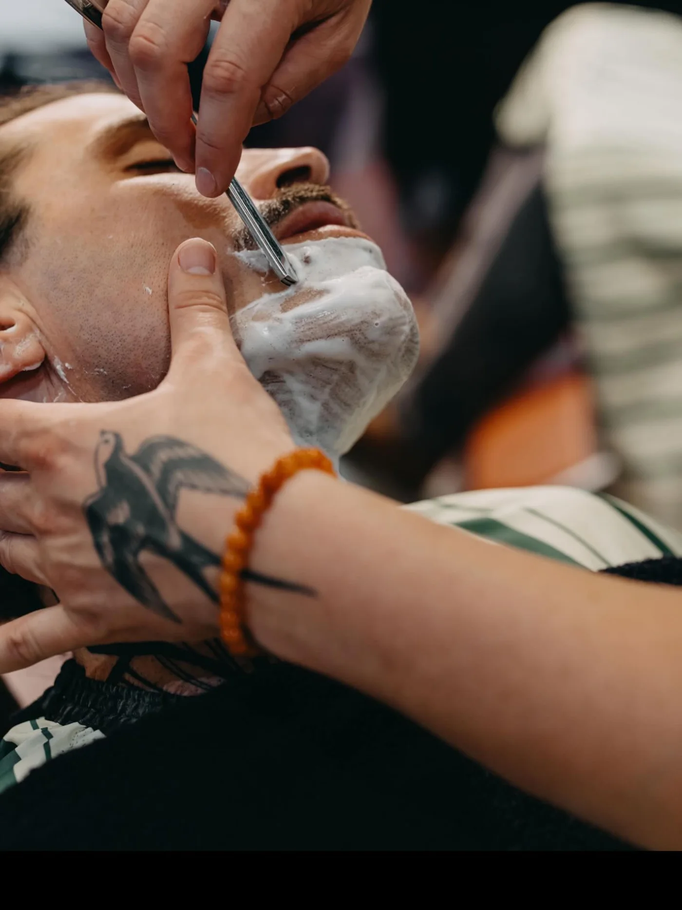A cut throat shave in progress at The Two Georges, Fremantle